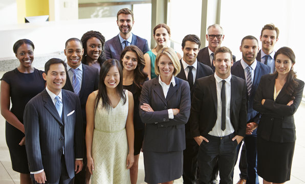 Portrait Of Multi-Cultural Office Staff Standing In Lobby