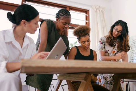 people working around a conference table